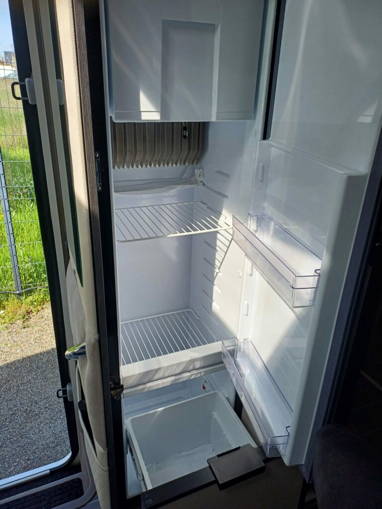 Spacious and bright refrigerator with several compartments in a CI 67 integral motorhome